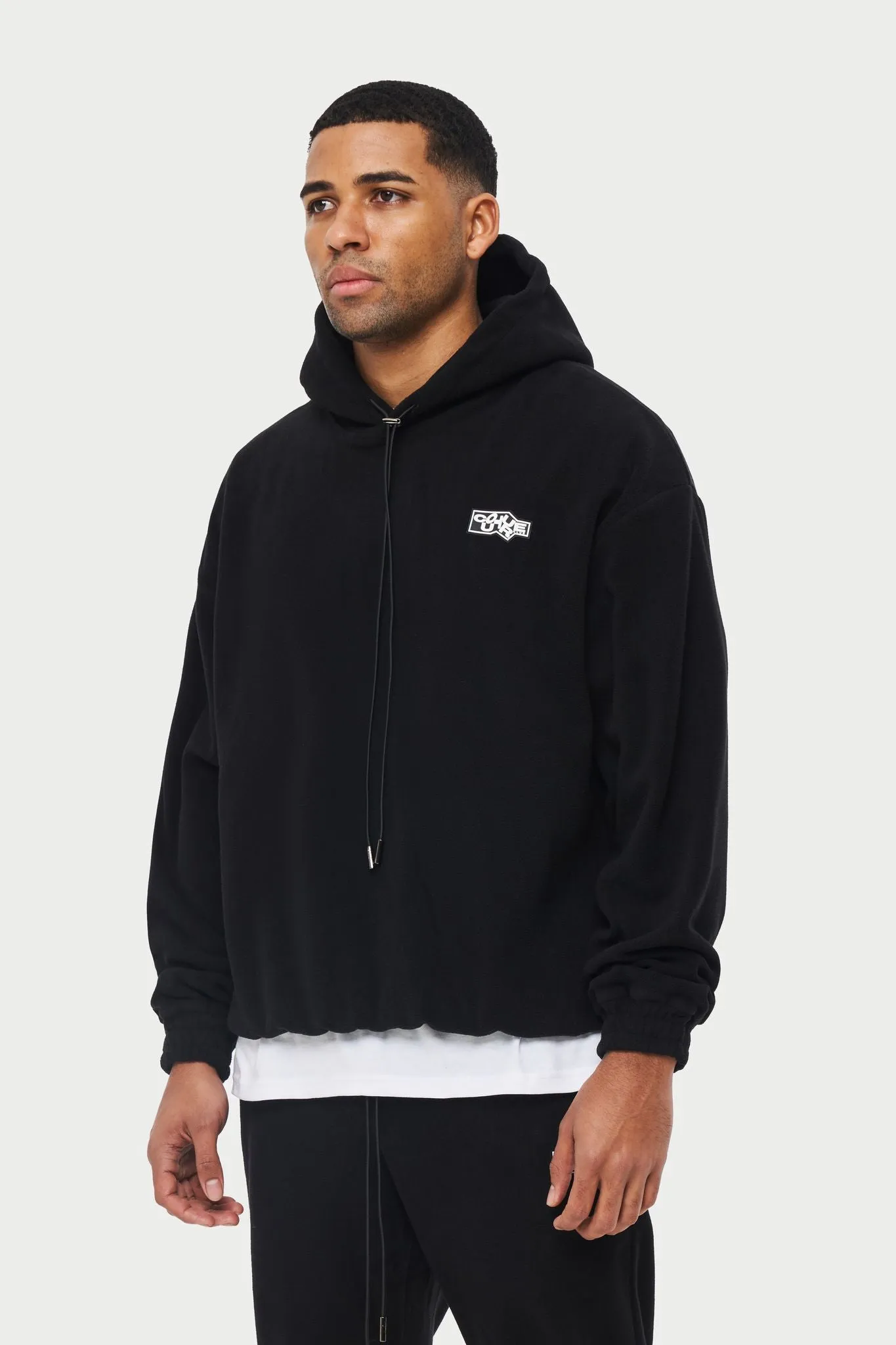 POLAR FLEECE RUBBER BADGE TRACKSUIT HOODIE - BLACK